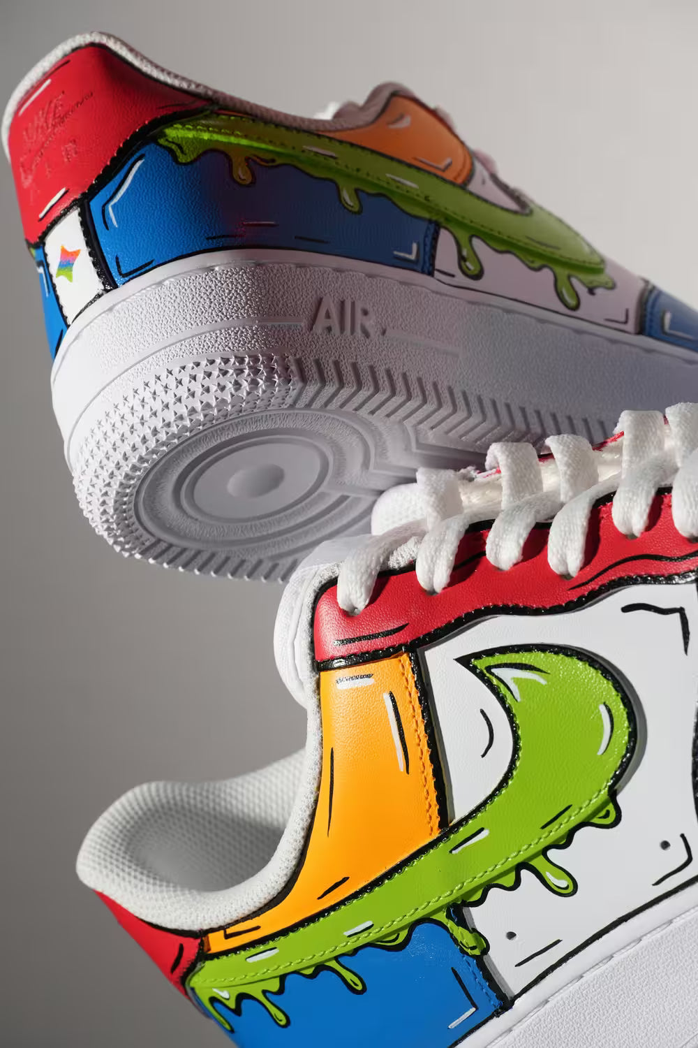 Colorful sneaker with cartoonish design on a gray background featuring Ebay New Ai Shopping assitant logo