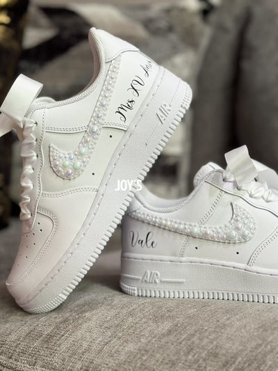 White wedding sneakers embellished with rhinestones, pearls, and subtle bling details