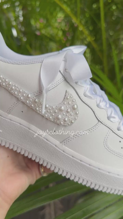Custom white wedding Nike Air Force 1 with pearl-embellished swoosh, white ribbon laces