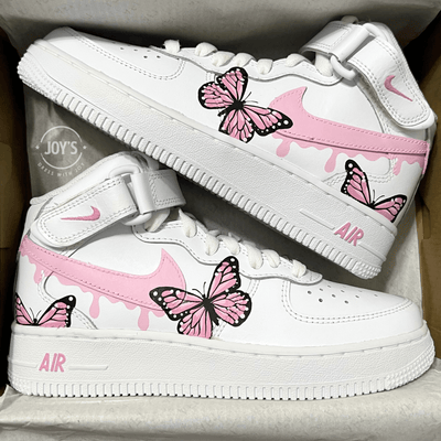 Pink Drip Pair of custom white Nike Air Force 1 sneakers with pink drip swoosh and hand-painted pink butterfly designs, displayed side by side 