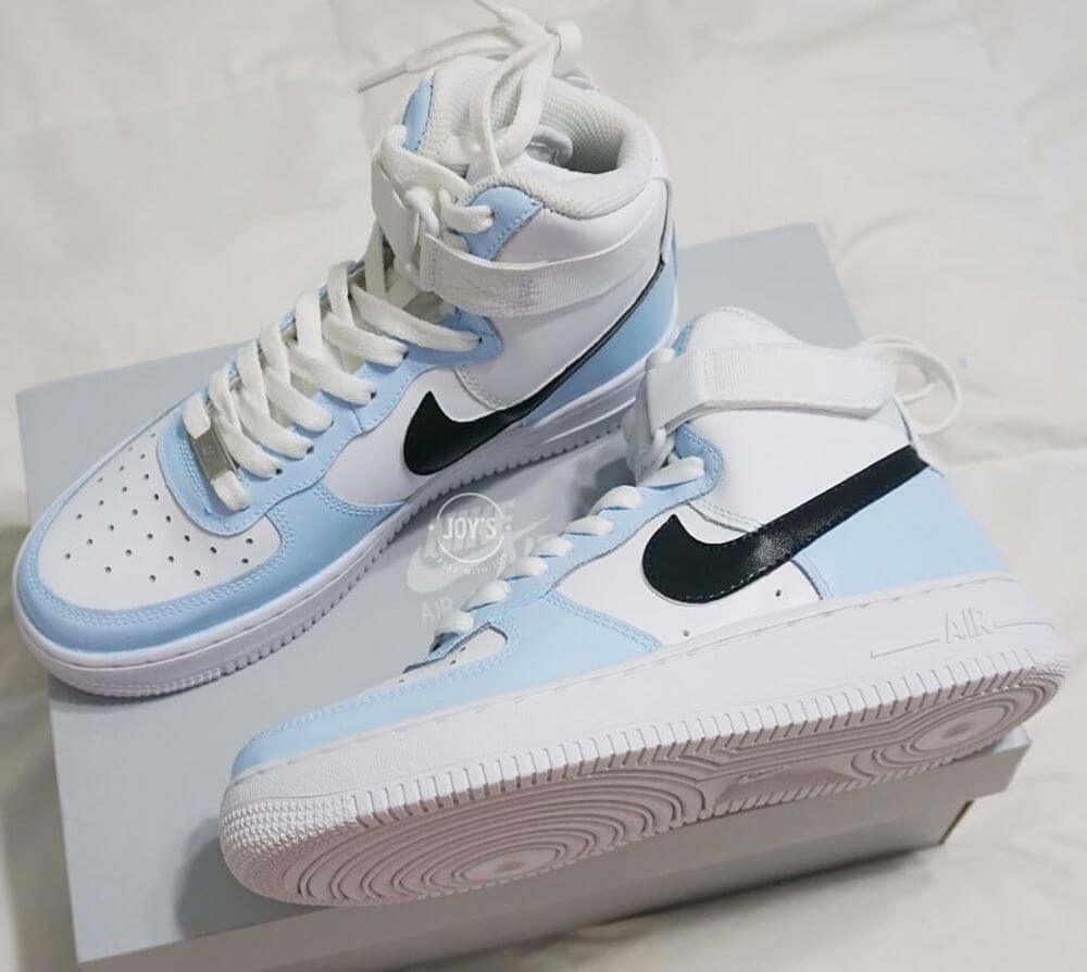 Nike Air Force 1 white and dark blue stylized swoosh