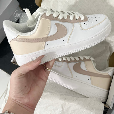 White Nike Air Force 1 Low with beige and cream color block panels.